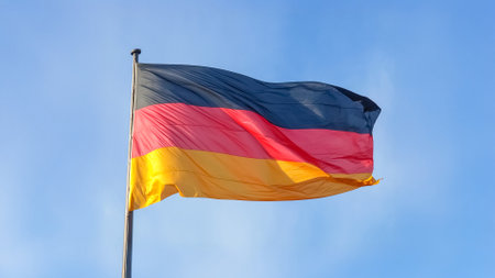 the German national flag of Germany, Europe over blue skyの写真素材