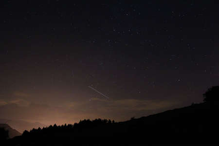 Starry summer sky with shooting starの写真素材