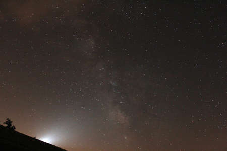 Summer sky on a starry night with the Milky Wayの写真素材