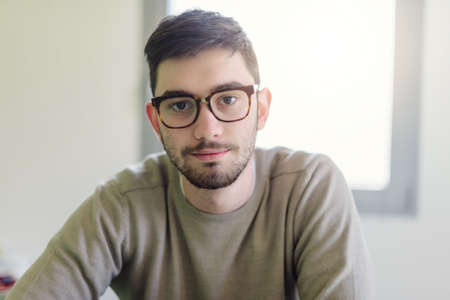 Portrait of student sitting at a desk