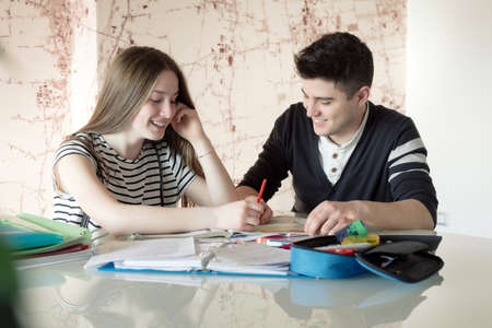 Brother helps her sister to do Their Homeworkの写真素材