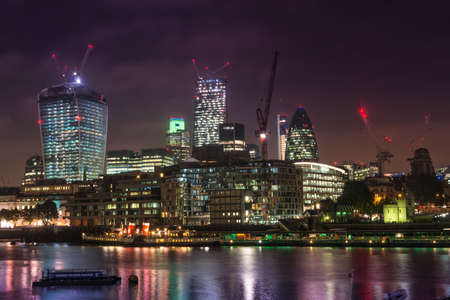 The skyline of the financial quarter of London at night.の写真素材