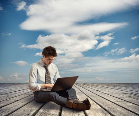 Young man with laptopの写真素材