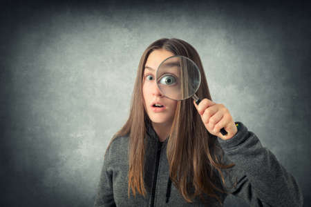 Young girl student with lensの写真素材