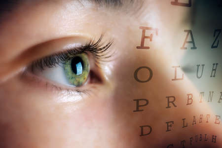 Eye of woman on background Snellen tableの写真素材