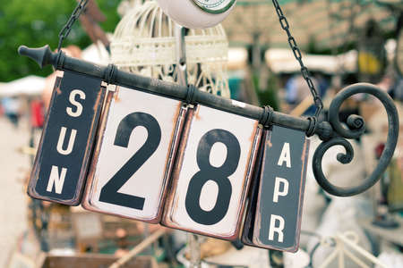 Old perpetual calendar iron at the flea marketの写真素材