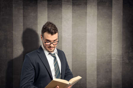 young man with bookの写真素材