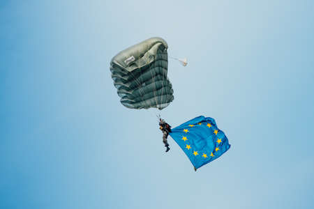 Zeltweg, Styria, Austria - September 3, 2016: Parachutist who hovers in the air with the European  flag on international event AIRPOWER16のeditorial素材