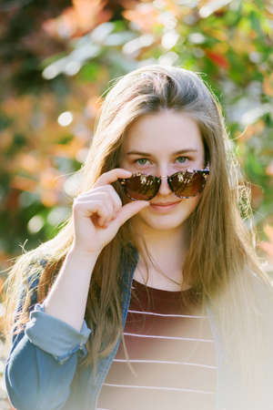 Portrait of a pretty teen girl outdoorsの写真素材