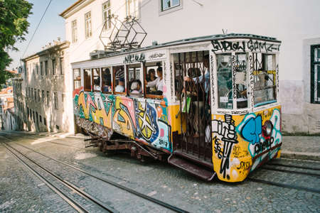 Lisbon, Portugal - May 8, 2017: Passengers in the Elevador from Gloria, are a funicular that is in...