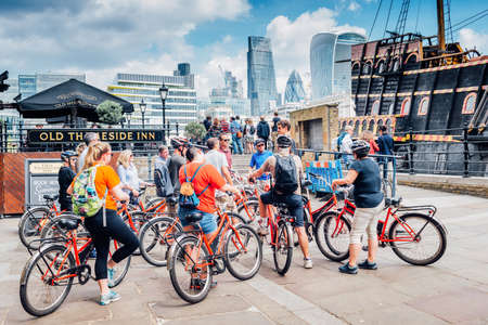 London, United Kingdom - May 24, 2017 : People with bicycle in the Queen's Walk along the Thamesのeditorial素材
