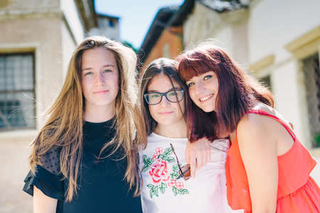 Happy teenage friends around the city