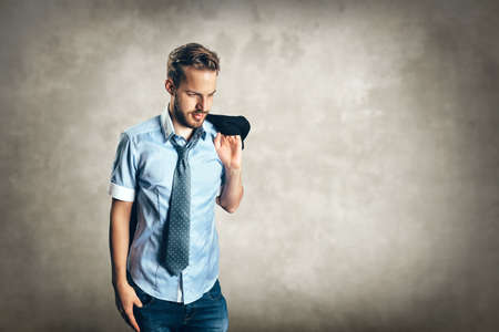 Portrait of young fashionable man wearing suit and tieの写真素材