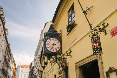 Prague, Czech Republic - May 22, 2018: Facade of the building and clock of the famous and ancient U Fleku breweryのeditorial素材