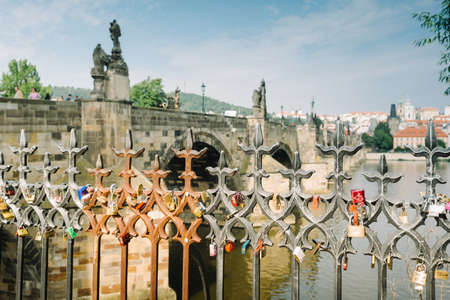 Prague, Czech Republic - May 23, 2018: padlocks on the railing in front of the Charles Bridgeのeditorial素材