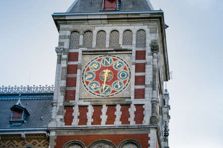 Amsterdam, Netherlands - May 14, 2019: wind clock tower of the central station in Amsterdamのeditorial素材