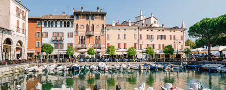 Desenzano Lake Garda, Italy - September 13, 2020: boats anchored in the small port of the historic centerのeditorial素材