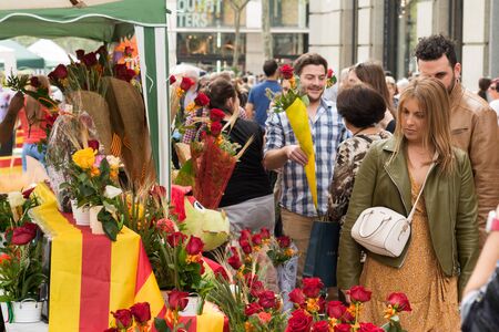 Barcelona, ??Spain-04/23/2018: Woman looks for roses in street storeのeditorial素材