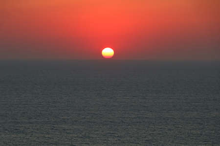 Summer sunset in Santorini island in Greeceの写真素材
