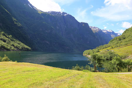 Naeroyfjord idyllic fjord landscape reflection, ship ferry, Norway, scandinaviaの写真素材
