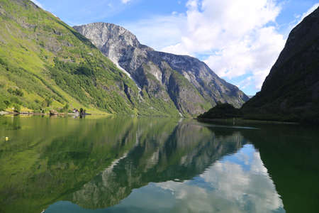 Naeroyfjord idyllic fjord landscape reflection, ship ferry, Norway, scandinaviaの写真素材