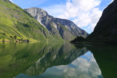 Naeroyfjord idyllic fjord landscape reflection, ship ferry, Norway, scandinaviaの写真素材