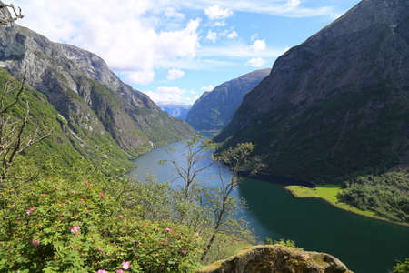 Naeroyfjord idyllic fjord landscape reflection, ship ferry, Norway, scandinaviaの写真素材