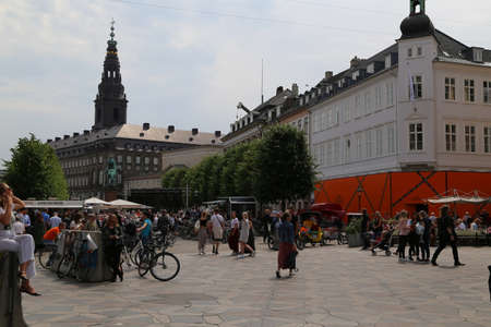 Crowds of shoppers and tourists enjoying the sunshine in the street of Copenhagenのeditorial素材