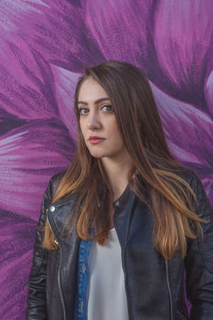 Young woman in urban landscape - graffitiの写真素材