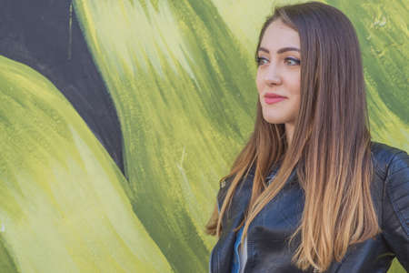 Young woman in urban landscape - graffitiの写真素材