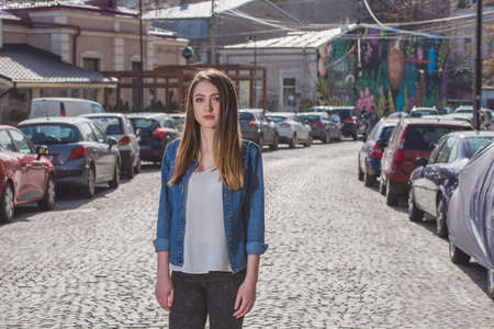 Beautiful girl in a photo shoot in the cityの写真素材