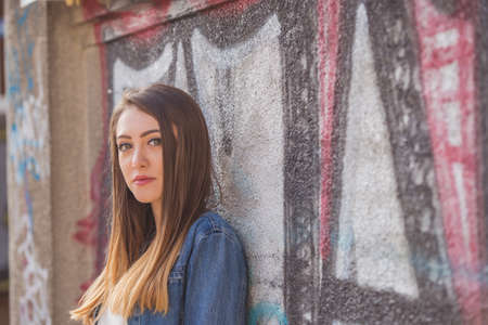 Beautiful girl in a photo shoot in the cityの写真素材