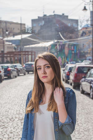 Beautiful girl in a photo shoot in the cityの写真素材