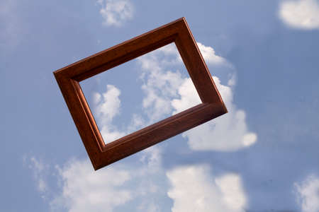 photo frame floating with clouds backgroundの写真素材