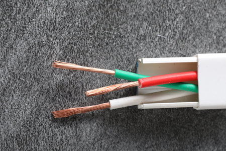 Electrical cable on gray background, closeup. Electricity concept.の写真素材