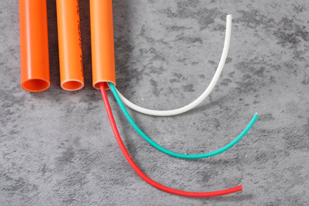 Colorful electrical cables on gray background. Copy space for text.の写真素材