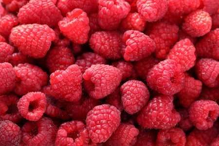 background of fresh raspberries, close-up, top view