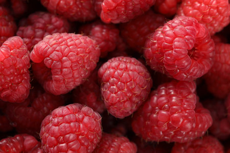background of fresh raspberries, close-up, top view