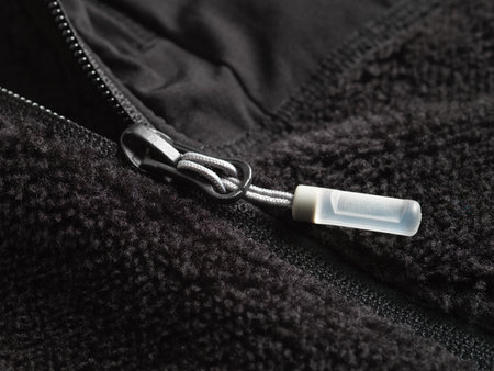 Zipper for clothes on a black background. Close-up.の写真素材