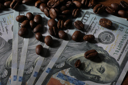 Coffee beans on the background of dollar bills. Close-up.