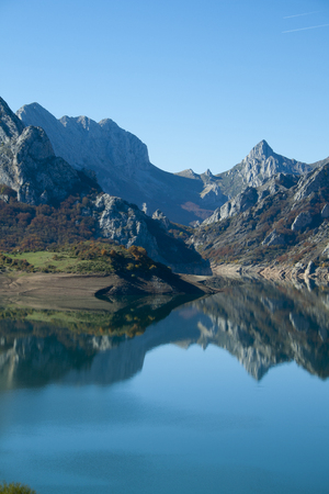 Mountains making an effect of symmetry on the waters of the reservoir.の写真素材