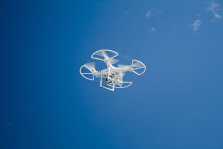 YEBES, SPAIN September 25, 2016. Drone in flight over the blue sky. Taken with Canon EOS 400D and processed With Adobe Photoshop CS5.のeditorial素材