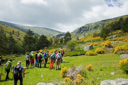 Rascafria, Spain, June 11, 2016: People hiking in a mountain valley in spring. Guadarrama Range National Park. A valley on the north slopes of the Sierra de Guadarrama mountain range.のeditorial素材