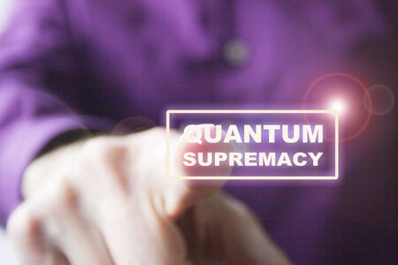 Pressing a virtual quantum supremacy button a right hand of a Caucasian man in purple shirt, as a concept of overcoming quantum computers to classics.の写真素材