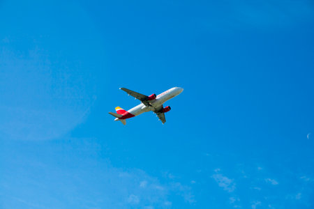 Paracuellos de Jarama, December, 14, 2020. Iberia plane just took off on a sunny day. Adolfo Suarez Madrid-Barajas international airportのeditorial素材