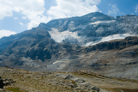 view of the 'Monte Perdido glacier from the MarborÃ© or Tuca Roya valley. The glacier is in clear recession due to climate change, it is expected to disappear in a few yearsの写真素材