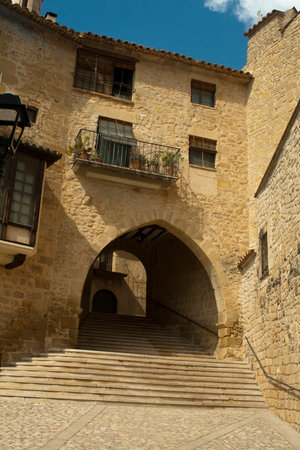 Historic Stone Archway and Staircase in Ancient European Town, Calaceite, Teruel province, Spainの写真素材