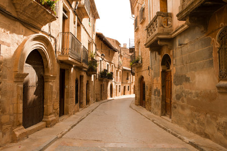 Charming Old Stone Street in Sunlight, Calaceite, Teruel province, Spainの写真素材