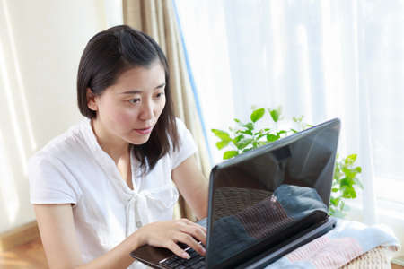 OL look at the computer screen and workingの写真素材