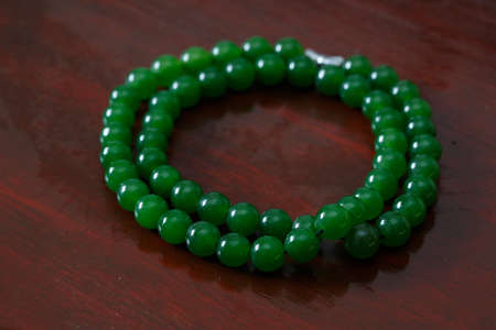 A bunch Green jade necklace  on the tableの写真素材